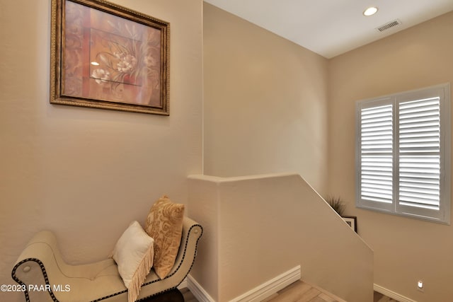 stairway featuring hardwood / wood-style floors