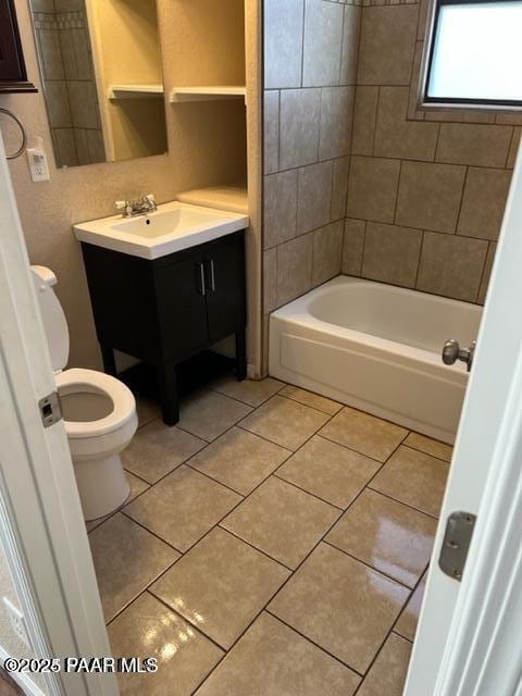 bathroom featuring shower / bathtub combination, toilet, vanity, and tile patterned flooring