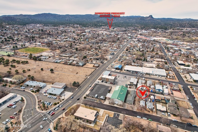 birds eye view of property with a mountain view