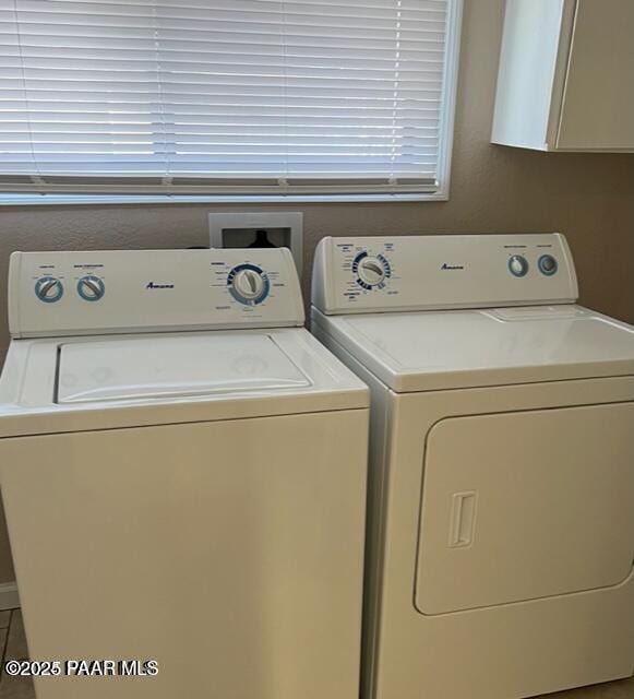 laundry room featuring laundry area and washing machine and dryer