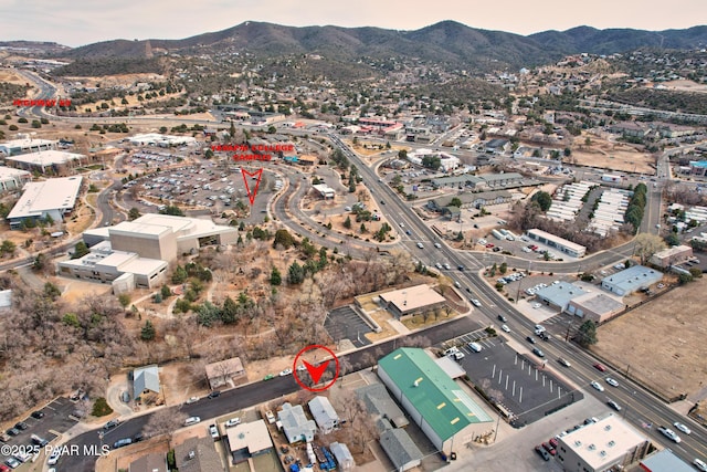 birds eye view of property with a mountain view