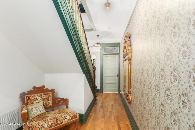 hallway with light hardwood / wood-style flooring