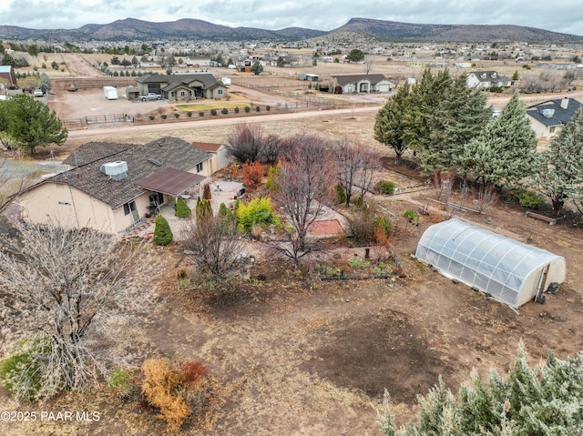 birds eye view of property featuring a mountain view