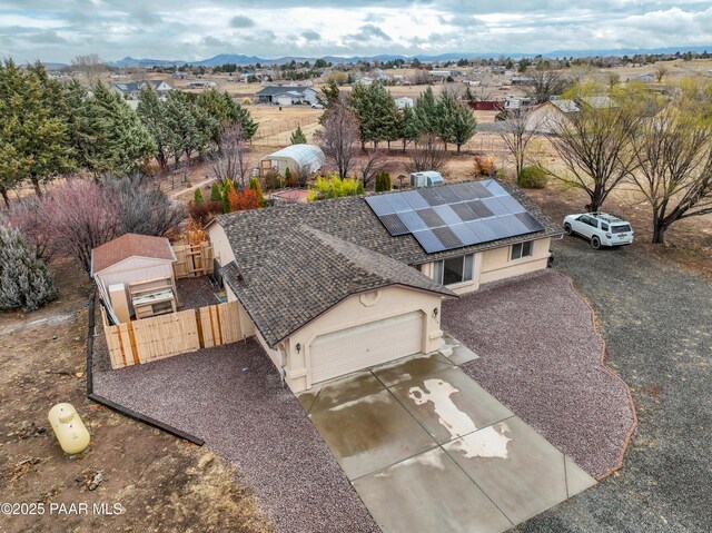 birds eye view of property featuring a mountain view and a residential view