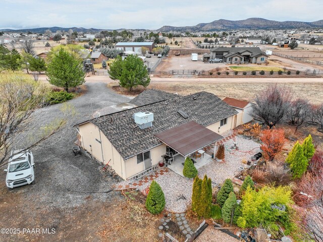 drone / aerial view featuring a mountain view