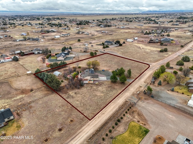 birds eye view of property with a desert view and a rural view