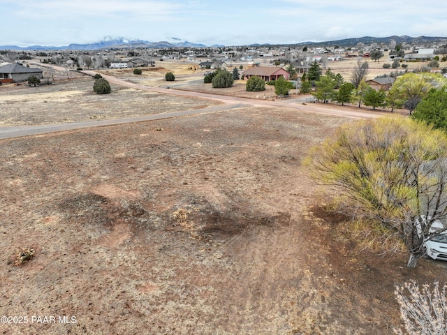 birds eye view of property with a mountain view