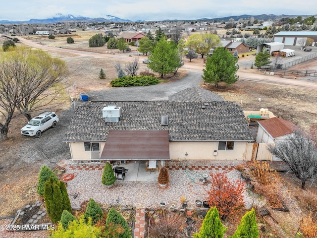 birds eye view of property featuring a mountain view