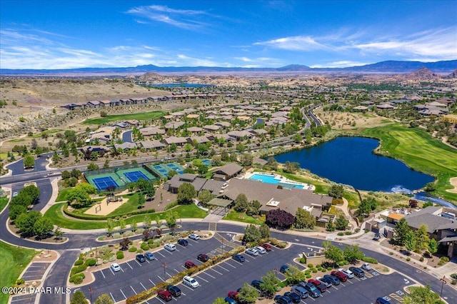 drone / aerial view featuring a water and mountain view