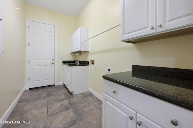 laundry room with sink, hookup for a washing machine, cabinets, and hookup for an electric dryer