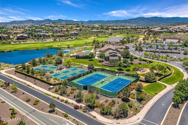 bird's eye view with a water and mountain view