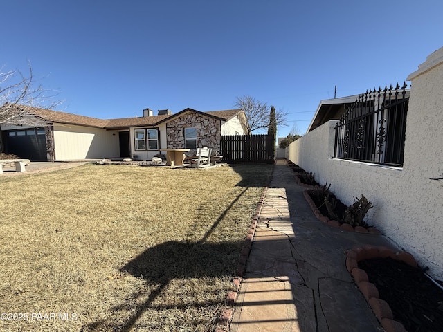 view of yard featuring a garage