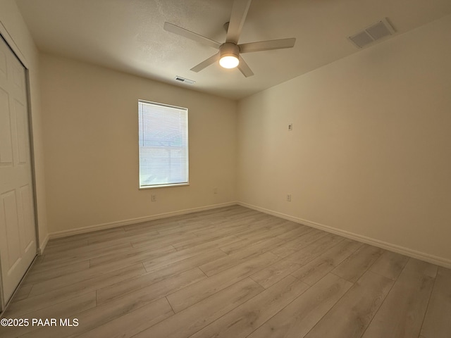 unfurnished bedroom featuring light hardwood / wood-style floors and ceiling fan