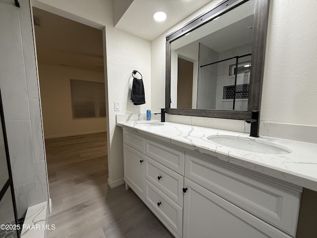 bathroom featuring wood-type flooring and vanity