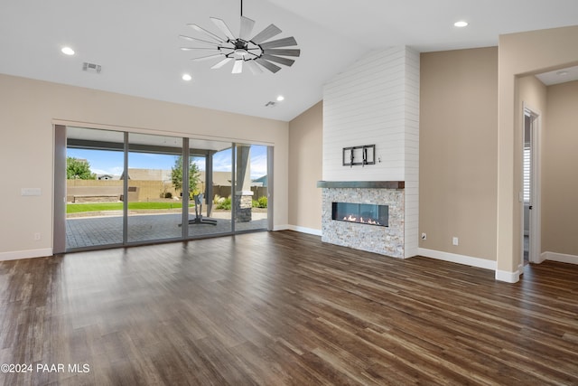 unfurnished living room with ceiling fan, dark hardwood / wood-style flooring, a fireplace, and high vaulted ceiling