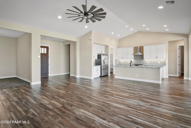 unfurnished living room with dark hardwood / wood-style floors, ceiling fan, lofted ceiling, and sink