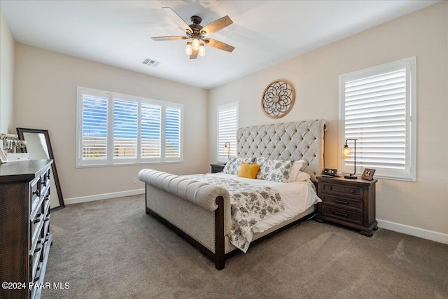 bedroom with ceiling fan and carpet