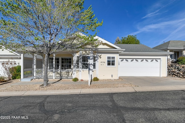 1836 Bond Cir, Prescott Valley, AZ 86314 - view of front of house featuring concrete driveway, covered porch, and a garage