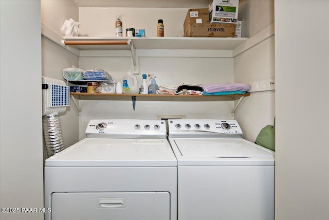 washroom featuring laundry area and washer and dryer