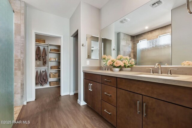 5248 Tranquil Bluff Way, Prescott, AZ 86301 - full bath featuring wood finished floors, tiled shower, double vanity, and baseboards