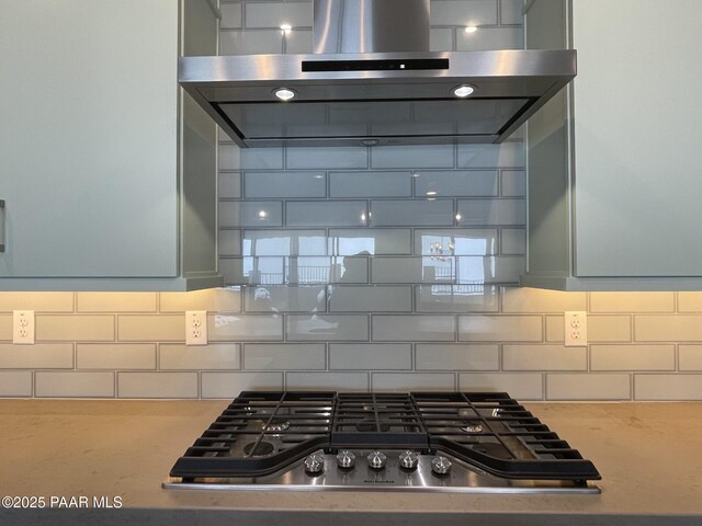 5248 Tranquil Bluff Way, Prescott, AZ 86301 - kitchen featuring extractor fan, stainless steel gas cooktop, and decorative backsplash