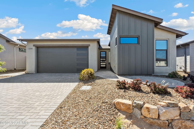 5248 Tranquil Bluff Way, Prescott, AZ 86301 - view of front of property featuring board and batten siding, an attached garage, and decorative driveway