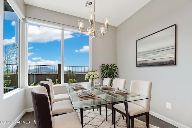 5248 Tranquil Bluff Way, Prescott, AZ 86301 - dining room featuring baseboards, a chandelier, and wood finished floors