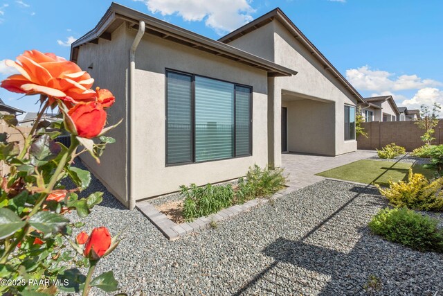 5248 Tranquil Bluff Way, Prescott, AZ 86301 - view of home's exterior featuring fence, stucco siding, and a patio