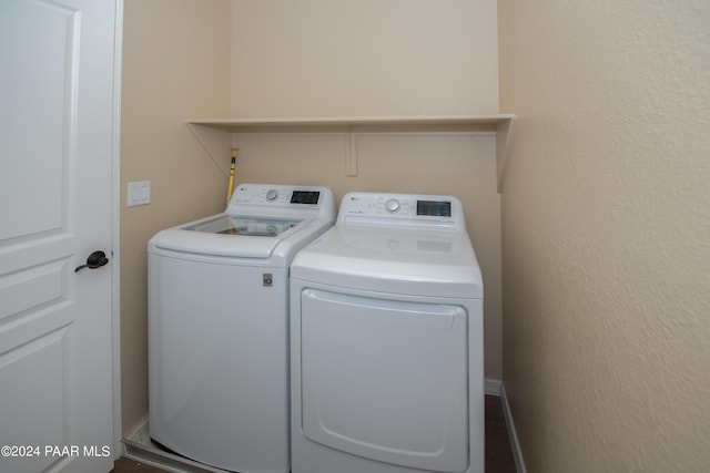 laundry room with washer and clothes dryer