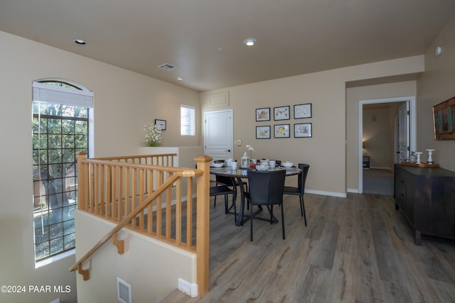 dining space featuring wood-type flooring