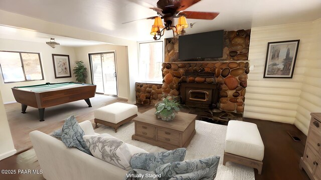 885 S Rancho Vista Dr, Prescott, AZ 86303 - living room with billiards table, wood finished floors, baseboards, a ceiling fan, and a wood stove