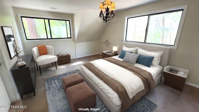 885 S Rancho Vista Dr, Prescott, AZ 86303 - bedroom featuring baseboards, a chandelier, and light wood-type flooring