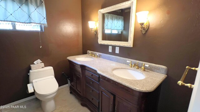 885 S Rancho Vista Dr, Prescott, AZ 86303 - bathroom featuring toilet, double vanity, and tile patterned flooring