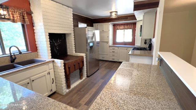 885 S Rancho Vista Dr, Prescott, AZ 86303 - kitchen featuring stainless steel fridge with ice dispenser, a sink, white cabinetry, dark wood-style floors, and light countertops