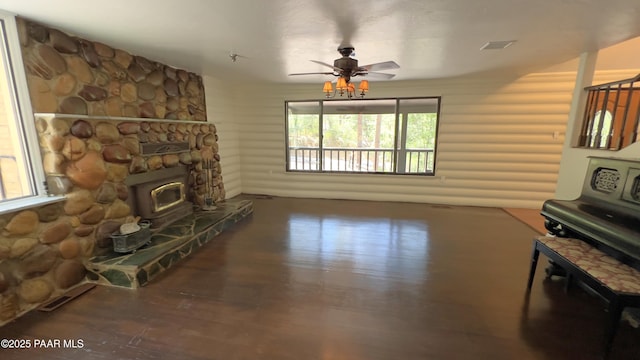885 S Rancho Vista Dr, Prescott, AZ 86303 - unfurnished living room with wood finished floors, a ceiling fan, and log walls