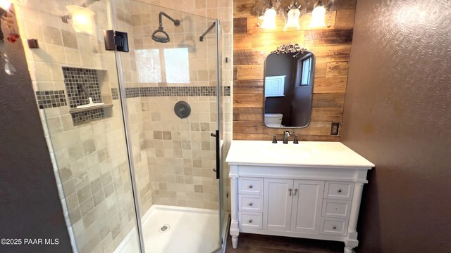 885 S Rancho Vista Dr, Prescott, AZ 86303 - bathroom featuring a shower stall, vanity, and wood walls