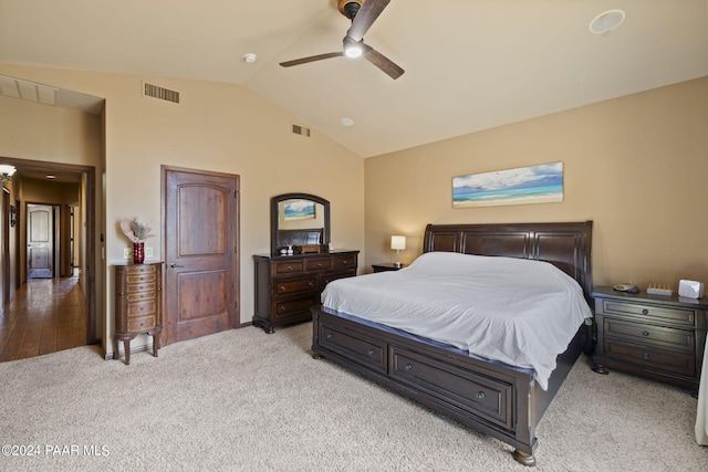 carpeted bedroom featuring ceiling fan and vaulted ceiling