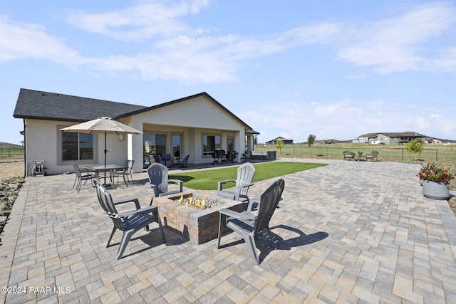 view of patio / terrace with a fire pit