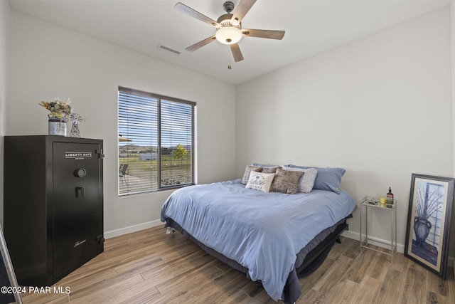 bedroom featuring ceiling fan and wood-type flooring