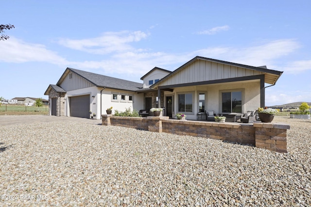 view of front of house with covered porch and a garage