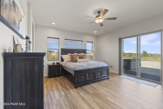 bedroom with access to outside, light hardwood / wood-style floors, and ceiling fan