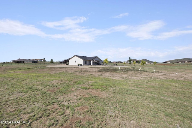 view of yard with a rural view