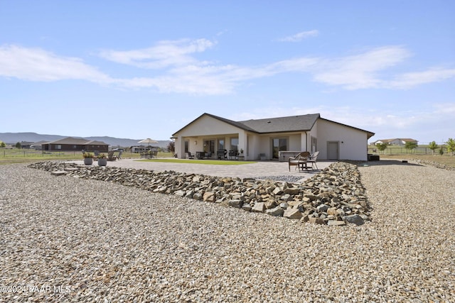 back of house with a patio area