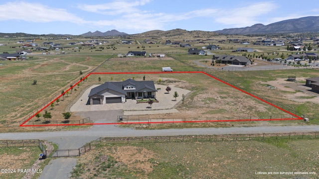 drone / aerial view featuring a mountain view and a rural view