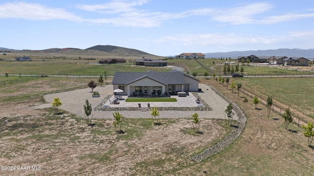 aerial view with a mountain view and a rural view