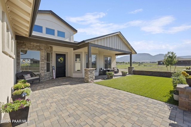 view of patio / terrace with a mountain view