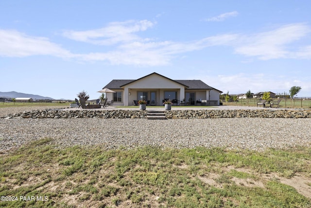 view of front of home with a patio and a garage