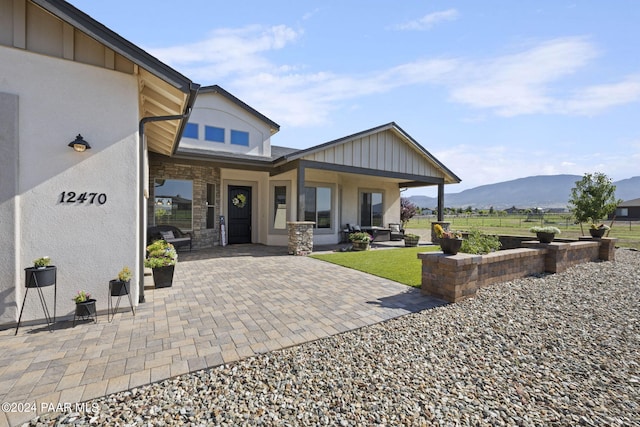 back of house featuring a mountain view