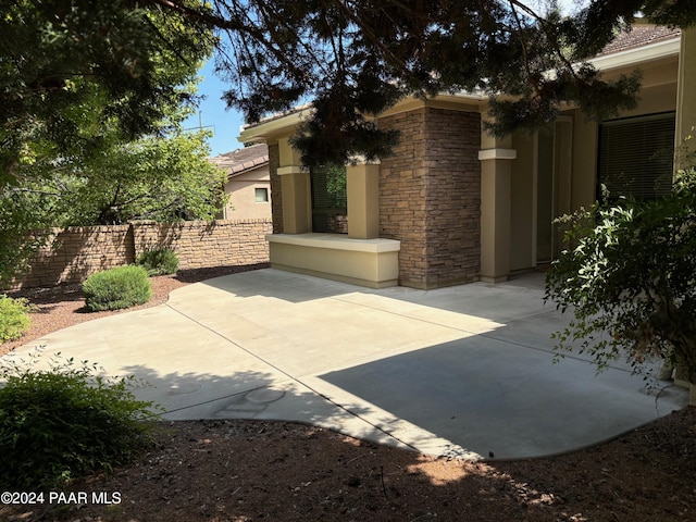 view of side of property with a patio area