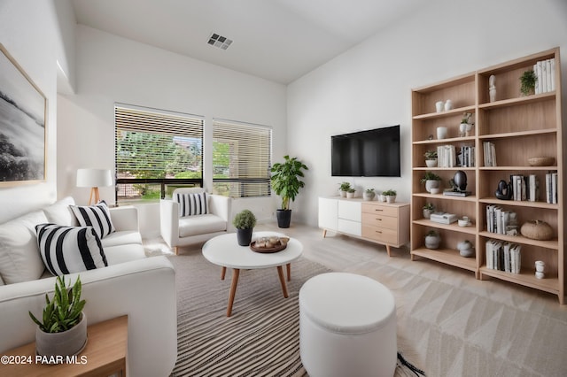 living room featuring light carpet